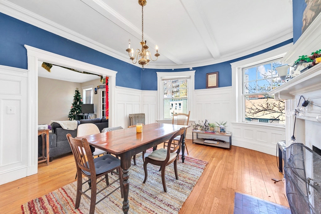 104 Strathmore Road Boston, MA 02135 - Photo 34 of 41 a view of a dining room with furniture window and wooden floor