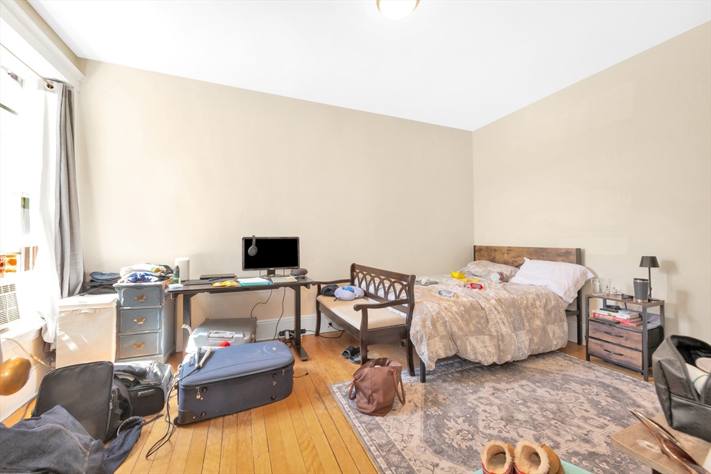 104 Strathmore Road Boston, MA 02135 - Photo 37 of 41 a living room with furniture and a flat screen tv