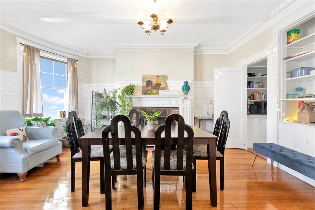 104 Strathmore Road Boston, MA 02135 - Photo 8 of 41 a view of a dining room with furniture and chandelier