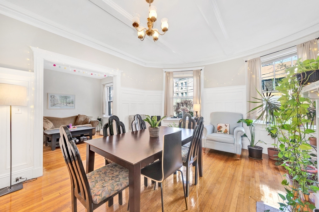 104 Strathmore Road Boston, MA 02135 - Photo 10 of 41 a view of a dining room with furniture window and wooden floor