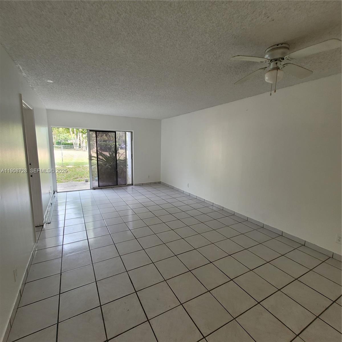 8540 Sherman Circle North, Unit 101 Miramar, FL 33025 - Photo 14 of 36 a view of an empty room and window