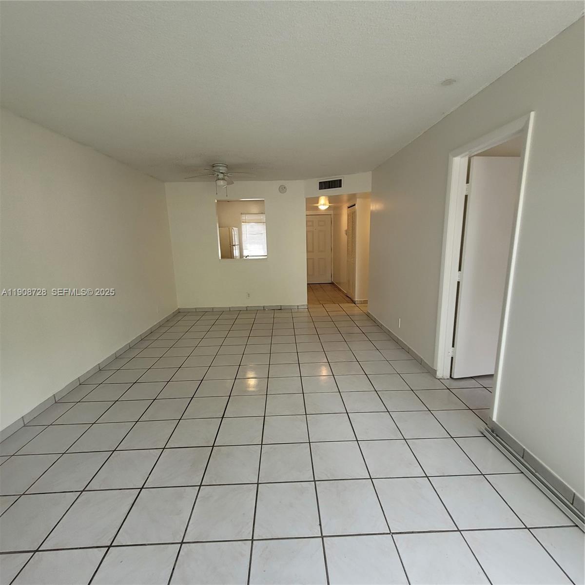 8540 Sherman Circle North, Unit 101 Miramar, FL 33025 - Photo 15 of 36 a view of an empty room and window