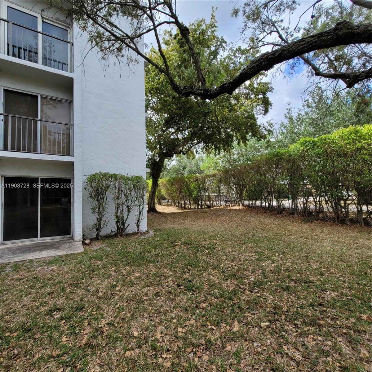 8540 Sherman Circle North, Unit 101 Miramar, FL 33025 - Photo 19 of 36 a view of a house with a yard