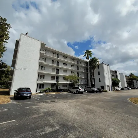 a view of car parked in front of a building