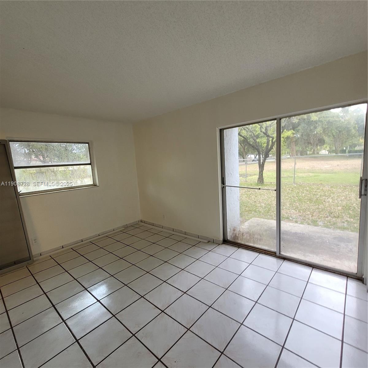 8540 Sherman Circle North, Unit 101 Miramar, FL 33025 - Photo 21 of 36 a view of an empty room and window