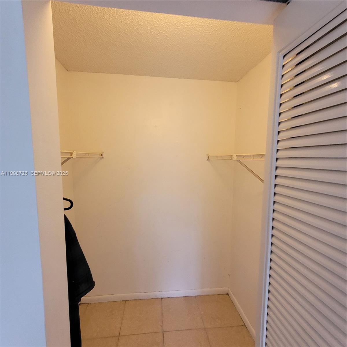 8540 Sherman Circle North, Unit 101 Miramar, FL 33025 - Photo 23 of 36 a bathroom with a shower