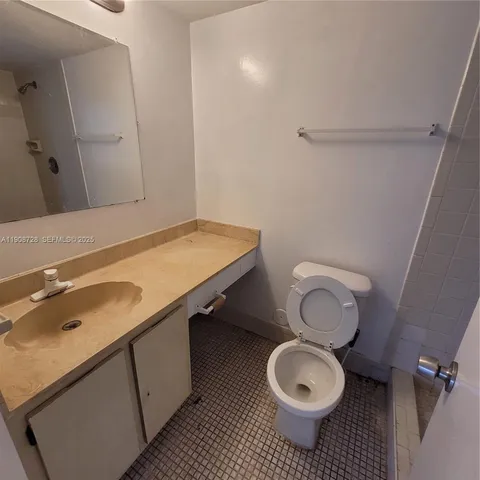 a bathroom with a toilet and a sink