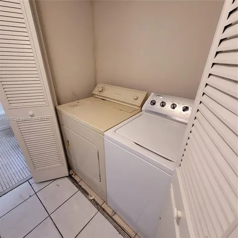 a bathroom with a granite countertop sink a toilet and bathtub
