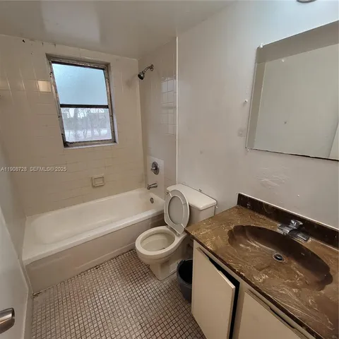 a view of a livingroom and window