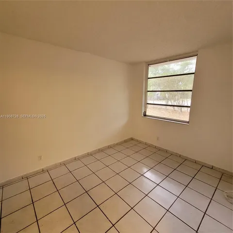 a view of a building with a yard