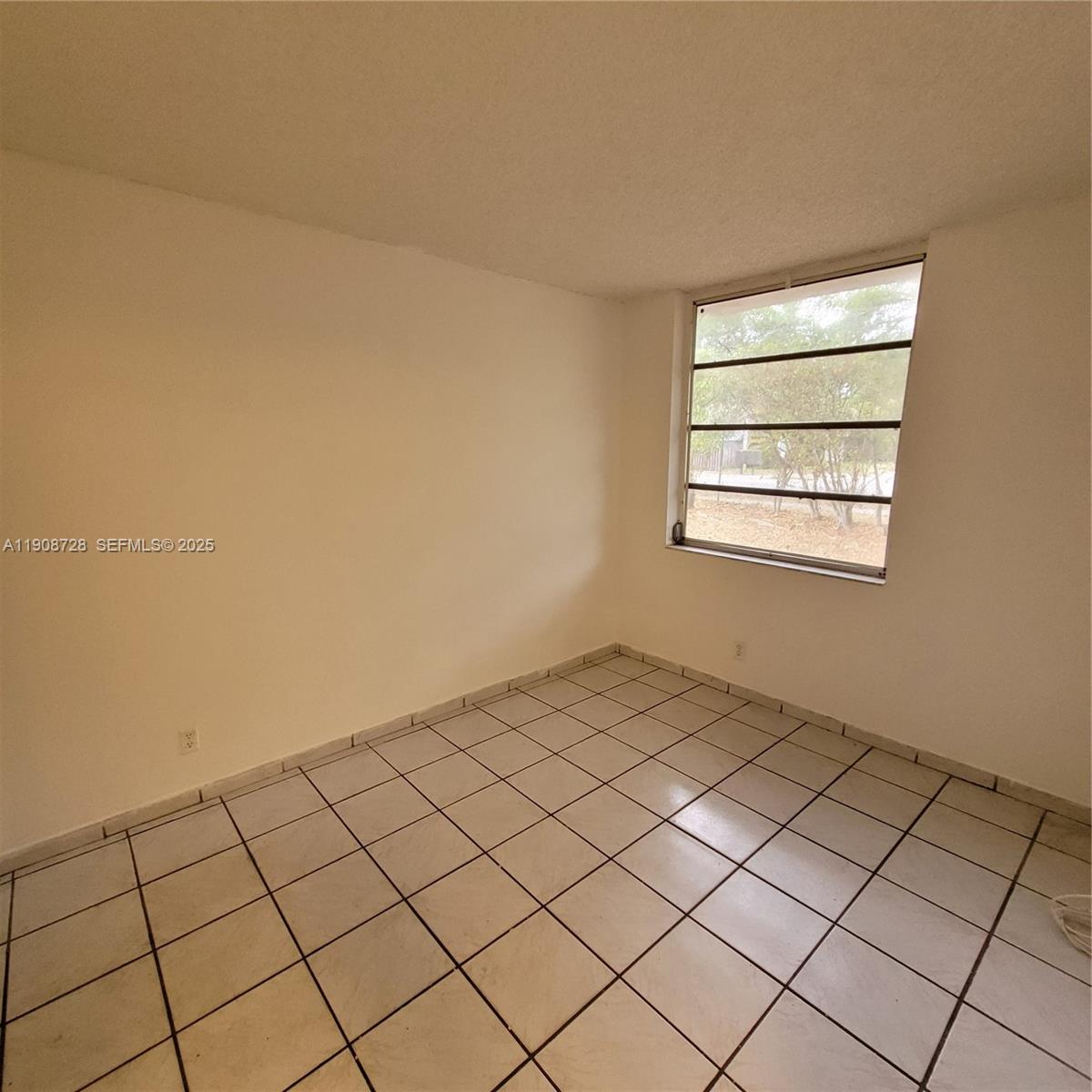 8540 Sherman Circle North, Unit 101 Miramar, FL 33025 - Photo 32 of 36 a view of a livingroom and window