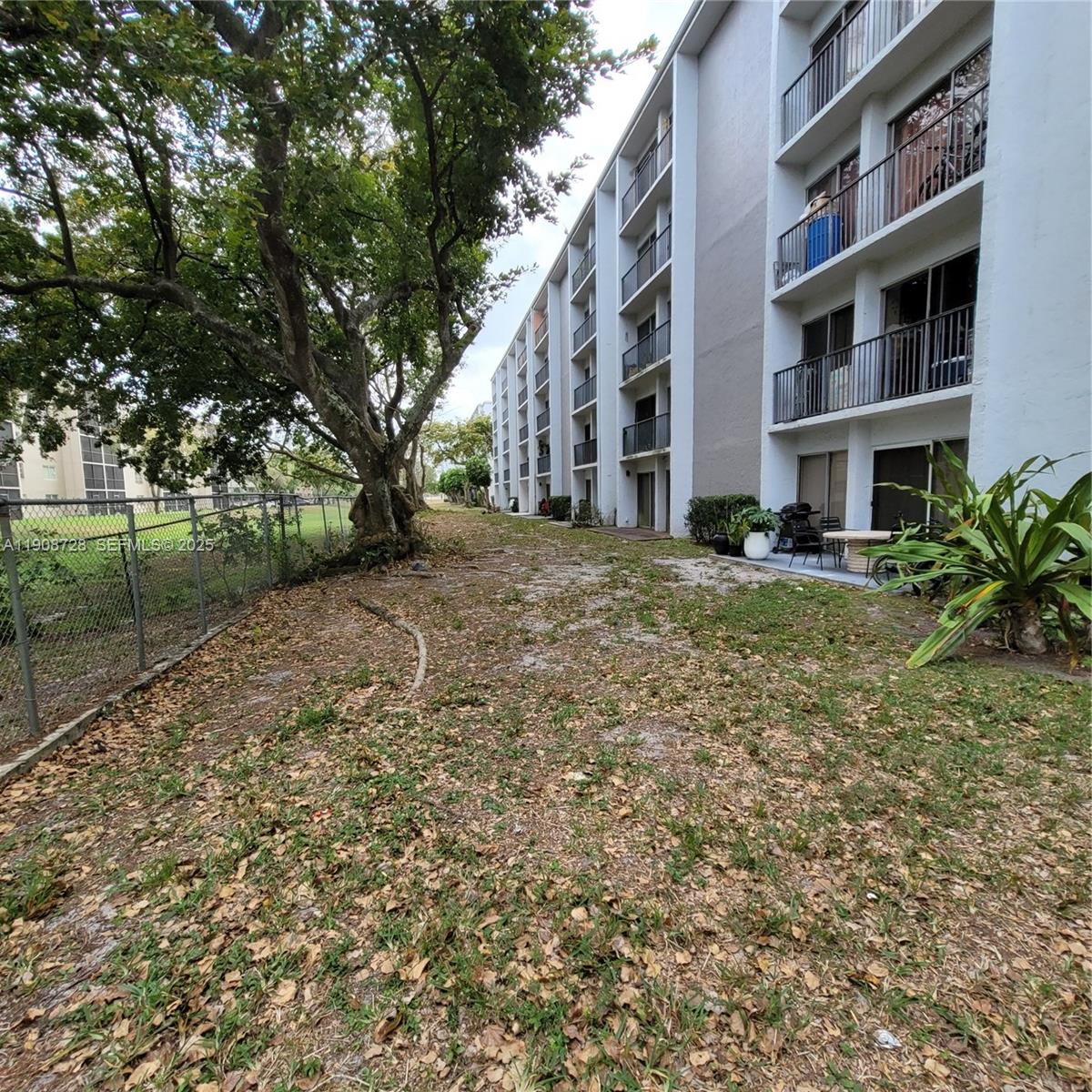 8540 Sherman Circle North, Unit 101 Miramar, FL 33025 - Photo 33 of 36 a view of a building with a yard