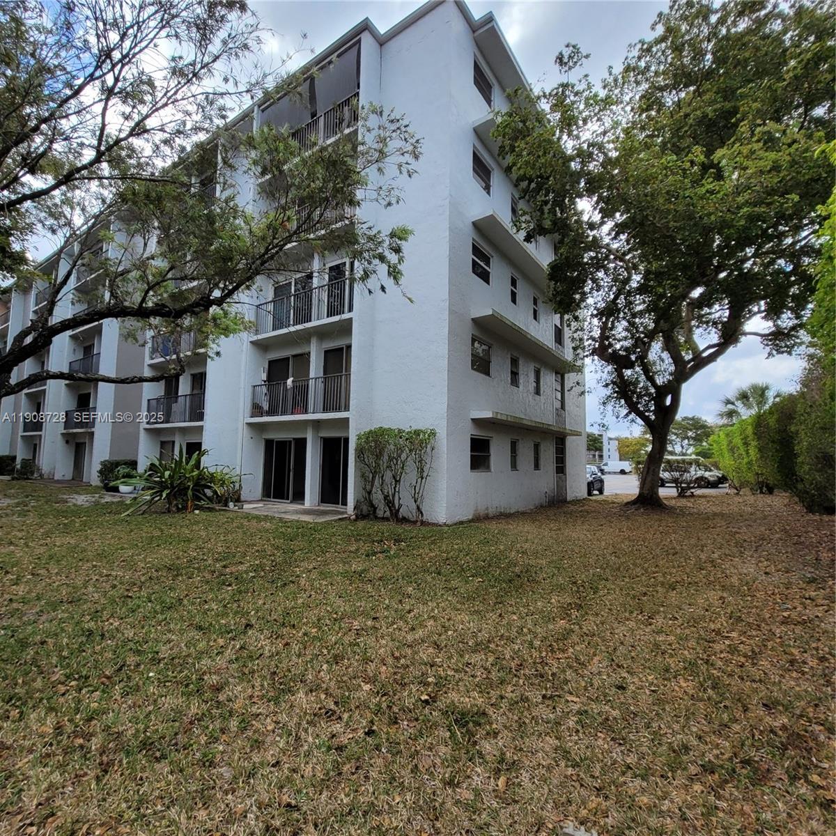 8540 Sherman Circle North, Unit 101 Miramar, FL 33025 - Photo 35 of 36 a view of a building with a yard