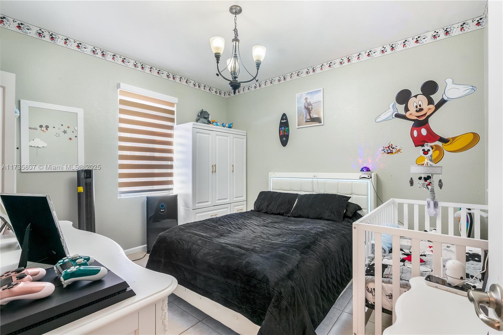 4170 Northeast 20th Street Homestead, FL 33033 - Photo 17 of 52 a bedroom with a bed and wooden floor