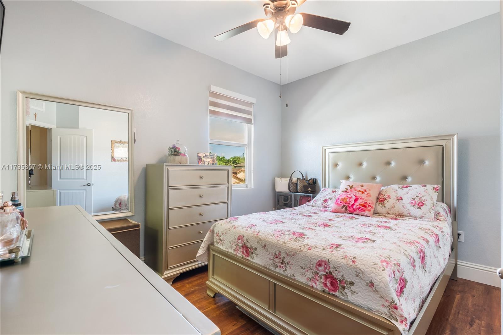 4170 Northeast 20th Street Homestead, FL 33033 - Photo 27 of 52 a bedroom with a bed and a chandelier