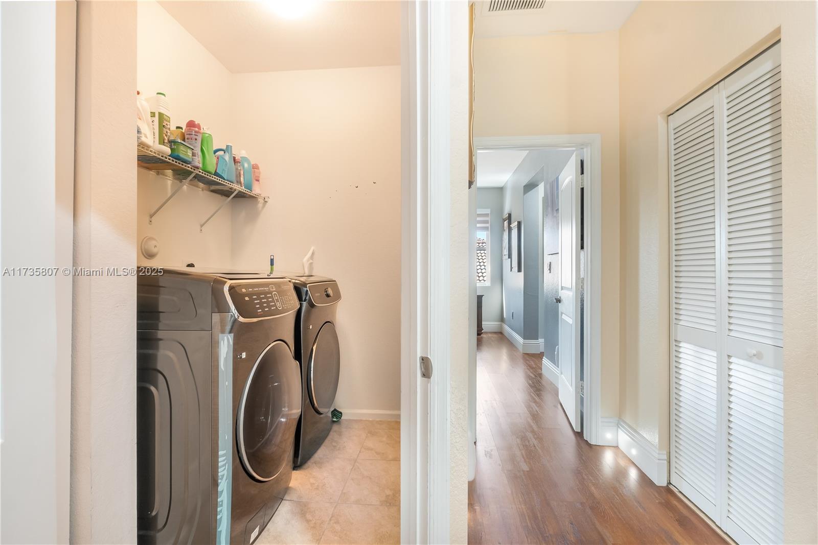 4170 Northeast 20th Street Homestead, FL 33033 - Photo 30 of 52 a view of a hallway with washer and dryer