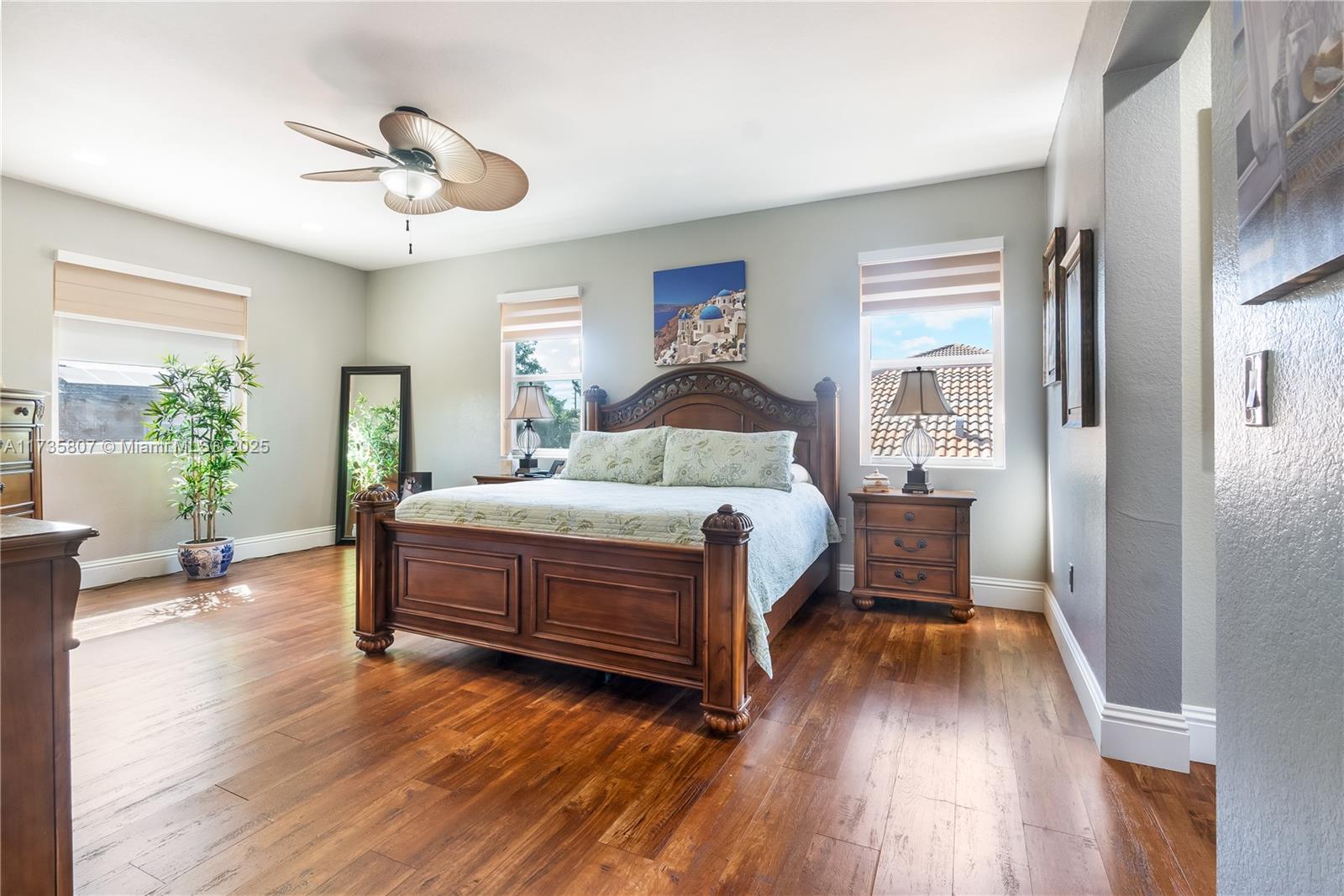 4170 Northeast 20th Street Homestead, FL 33033 - Photo 31 of 52 a bedroom with a bed and wooden floor