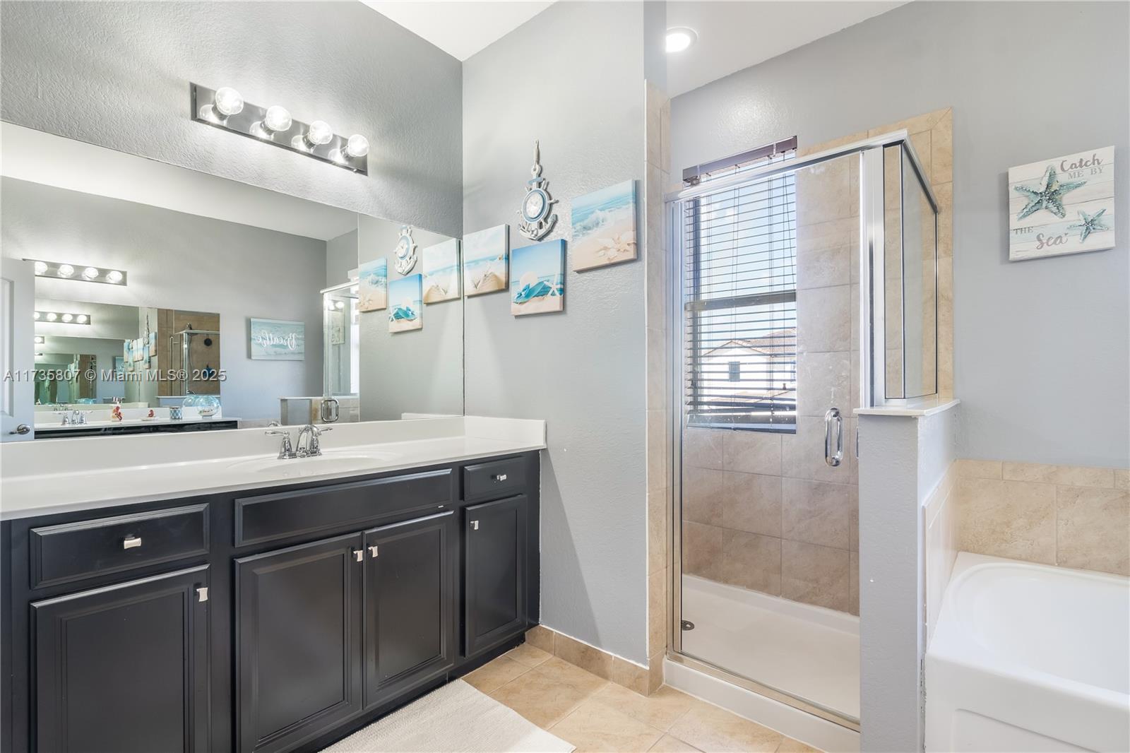 4170 Northeast 20th Street Homestead, FL 33033 - Photo 36 of 52 a bathroom with a shower sink and mirror