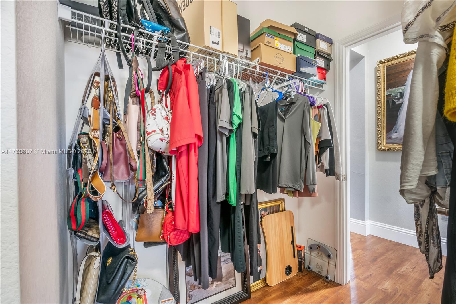 4170 Northeast 20th Street Homestead, FL 33033 - Photo 39 of 52 a view of walk in closet with clothes and shoes