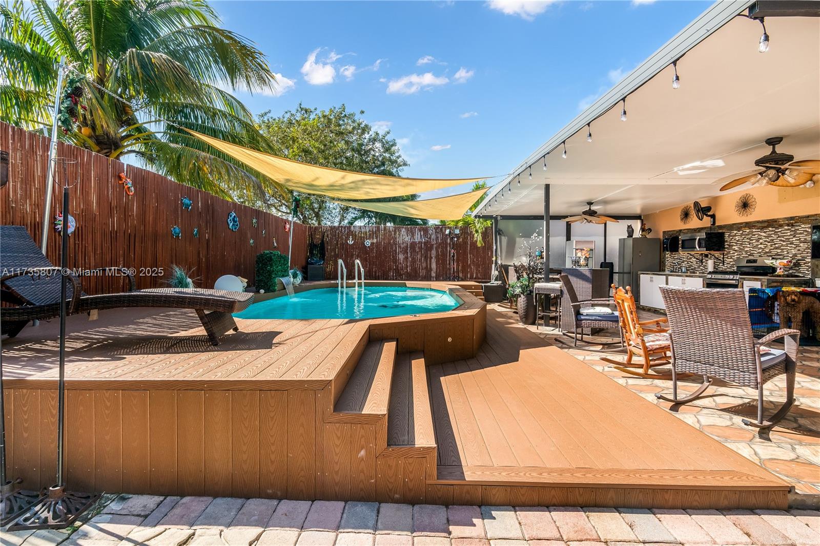 4170 Northeast 20th Street Homestead, FL 33033 - Photo 43 of 52 a view of a swimming pool with a patio and plants