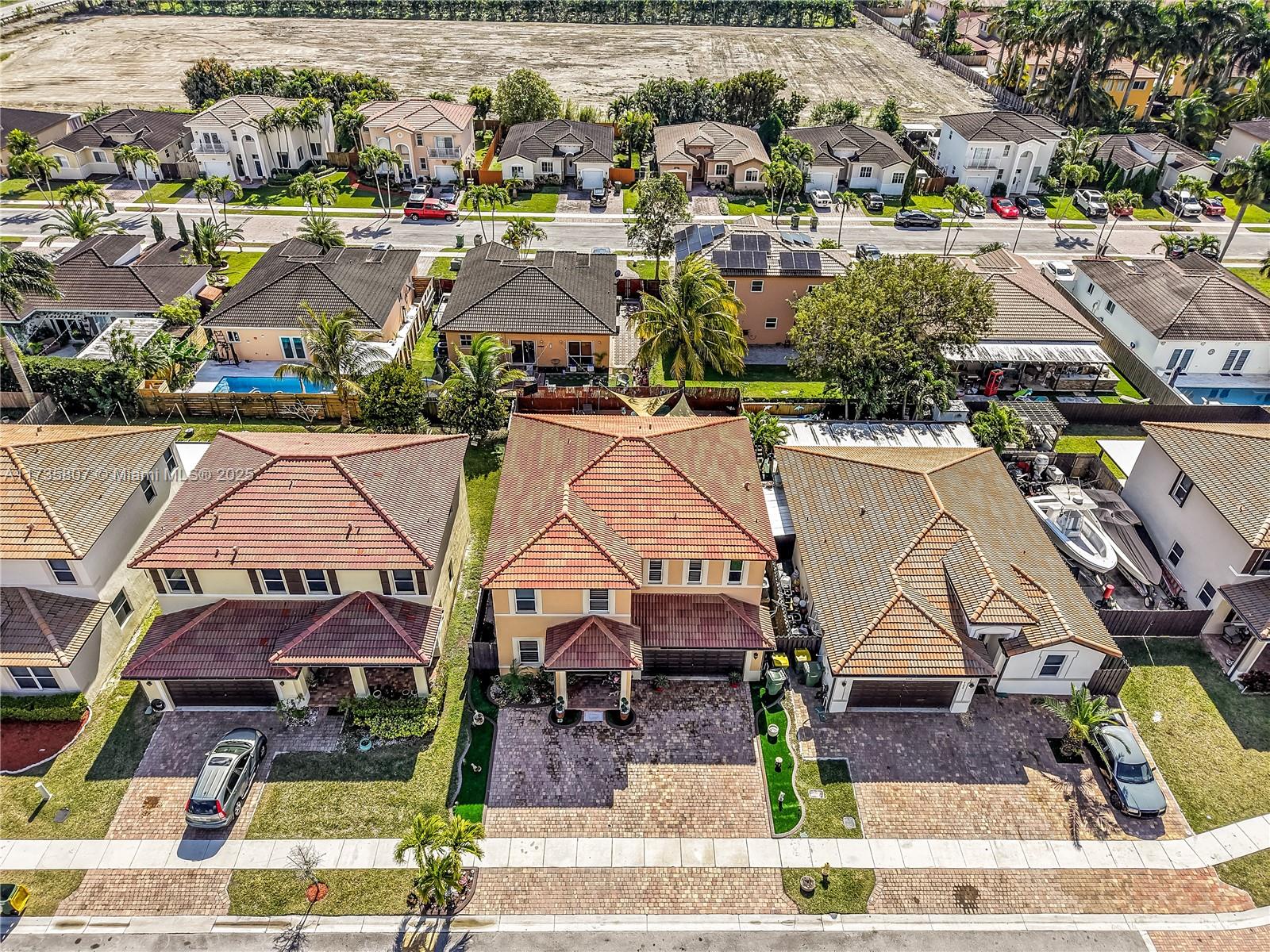 4170 Northeast 20th Street Homestead, FL 33033 - Photo 49 of 52 an aerial view of residential houses with outdoor space and parking