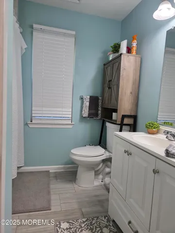 a view of two chairs in the balcony