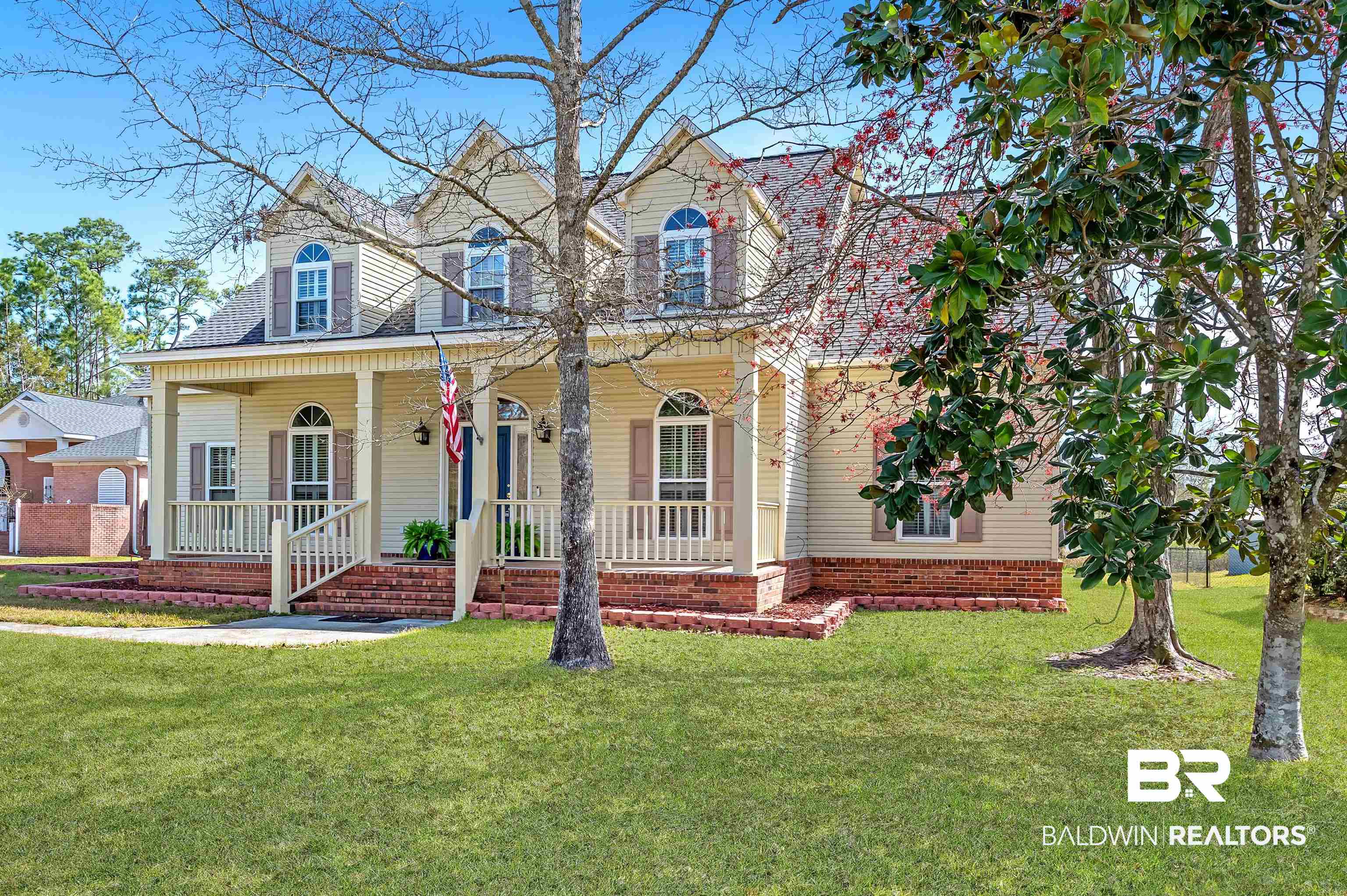 8915 Bay Point Drive Elberta, AL 36530 - Photo 1 of 74 View of front of property with covered porch and a front lawn