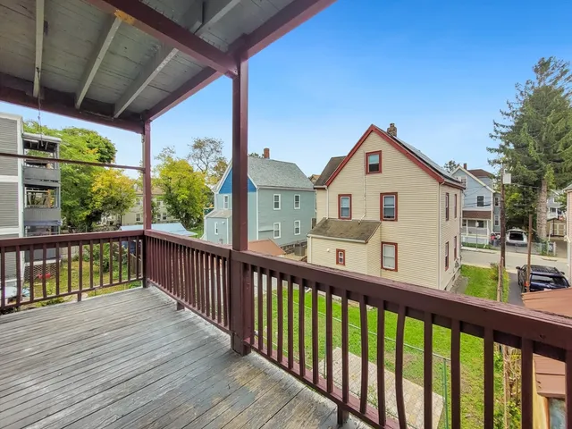 a view of a two chairs in the balcony