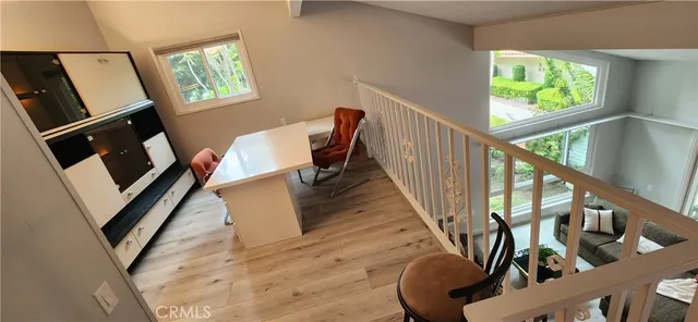 a view of an entryway with wooden floor and door