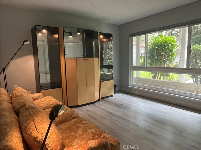 a living room with furniture and a gate