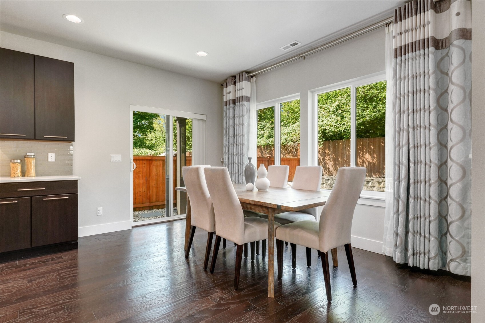 1907 240th Place Southwest Bothell, WA 98021 - Photo 6 of 28 a view of a dining room with furniture and wooden floor