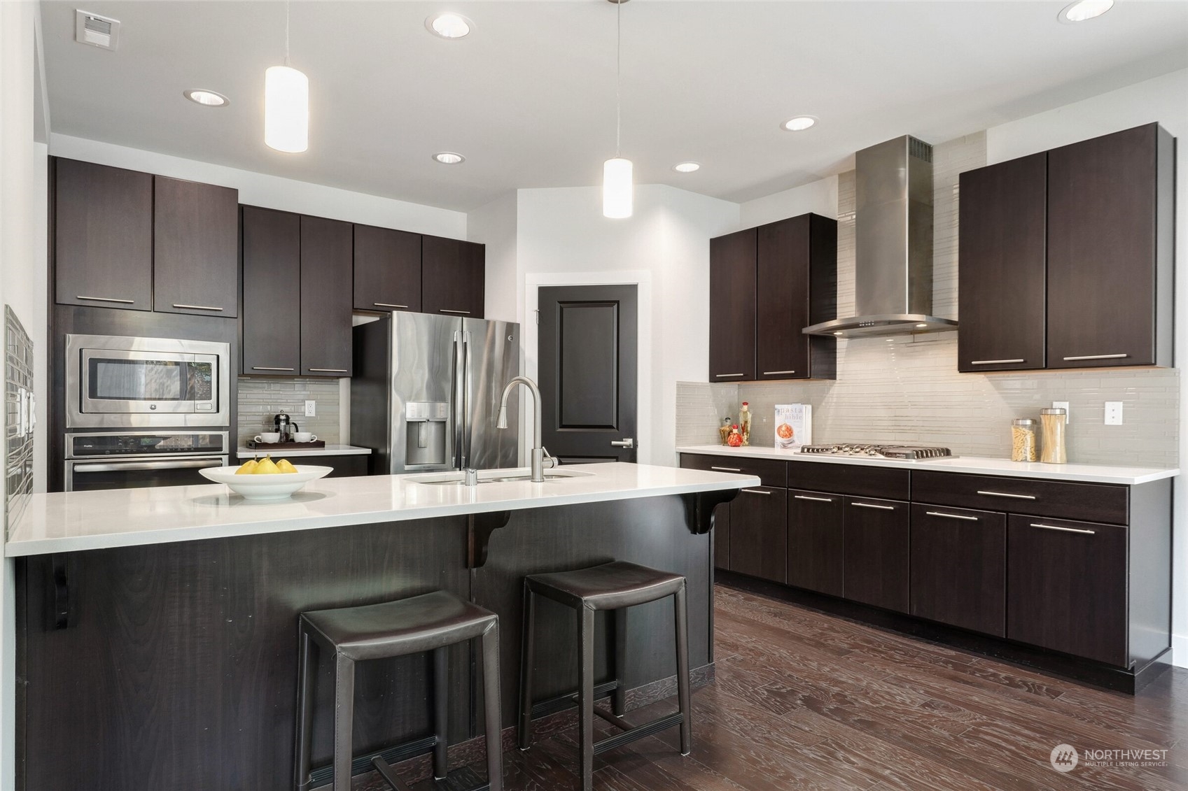 1907 240th Place Southwest Bothell, WA 98021 - Photo 7 of 28 a large kitchen with stainless steel appliances and a sink