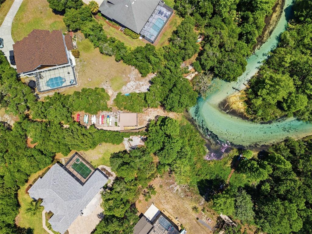 6153 New Osprey Point Weeki Wachee, FL 34607 - Photo 63 of 65 an aerial view of a house with a garden and lake view