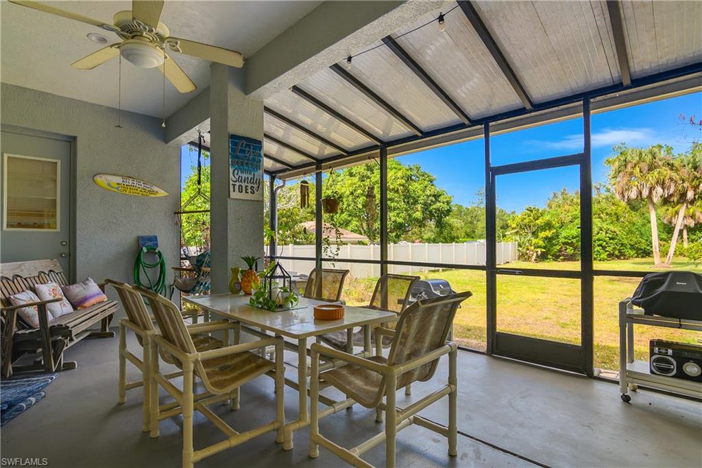 6175 Green Boulevard Naples, FL 34116 - Photo 12 of 20 a view of a dining room with furniture window and outside view