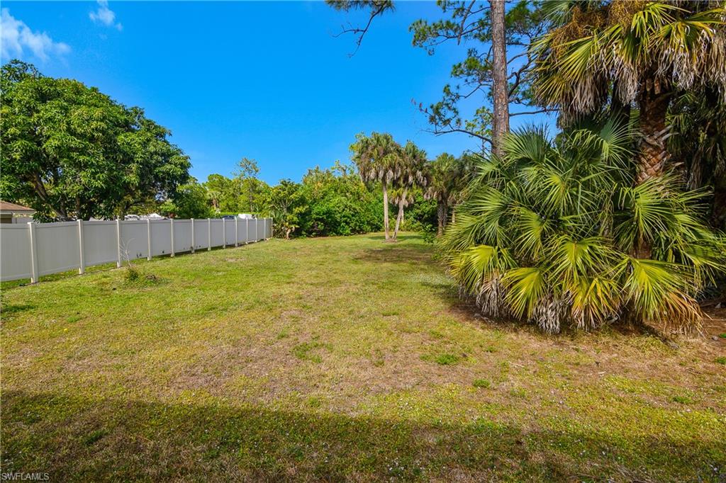 6175 Green Boulevard Naples, FL 34116 - Photo 16 of 20 a view of a yard with a house