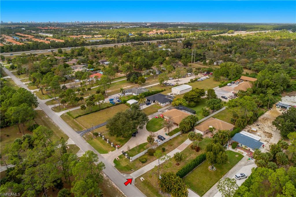 6175 Green Boulevard Naples, FL 34116 - Photo 20 of 20 an aerial view of residential building and green space