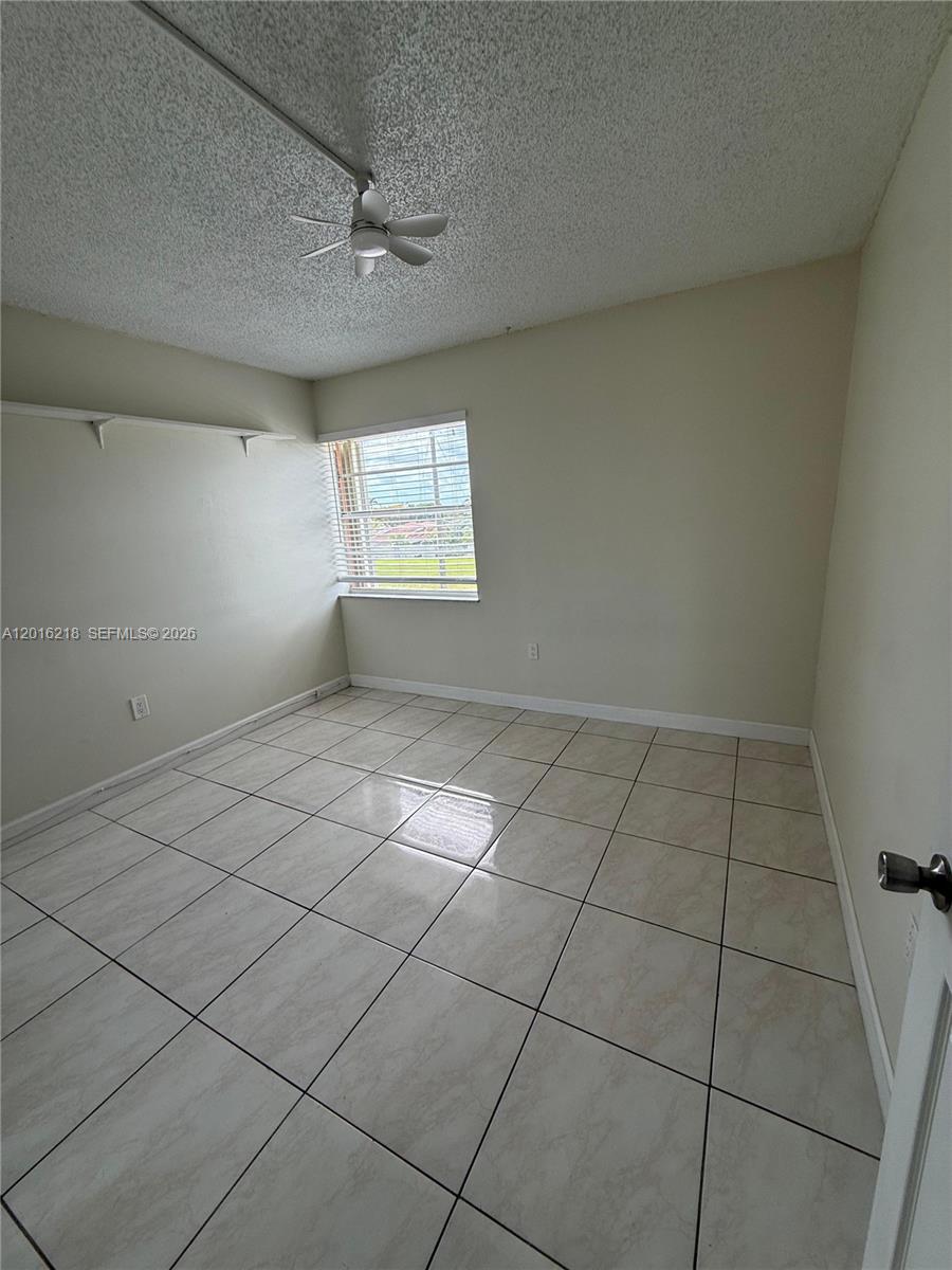 9321 Southwest 4th Street, Unit 230C Miami, FL 33174 - Photo 31 of 37 a view of an empty room and window
