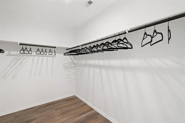 a view of a wall with wooden floor