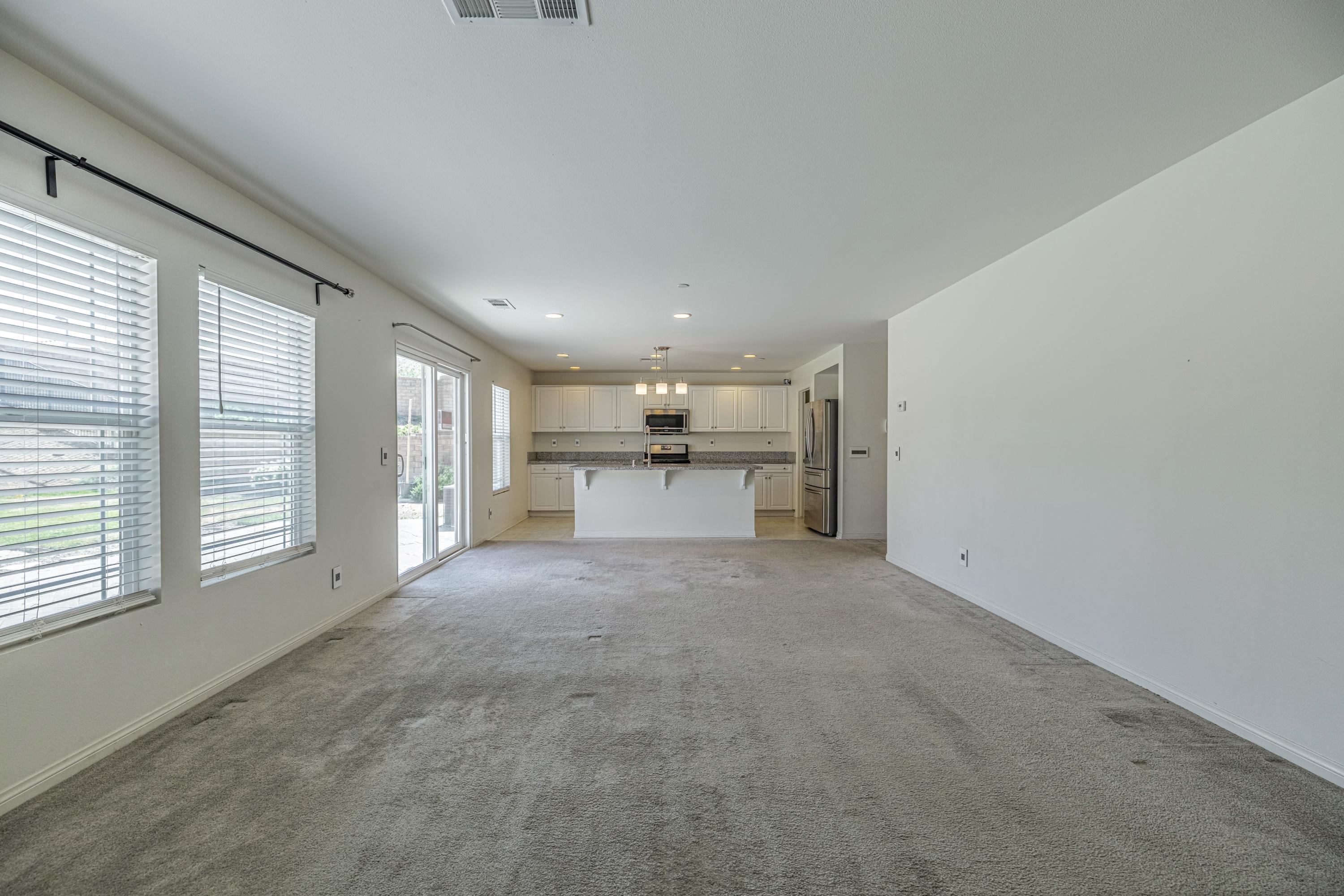 2732 Hemlock Road Palmdale, CA 93551 - Photo 12 of 42 a view of a electric appliances and windows in an empty room