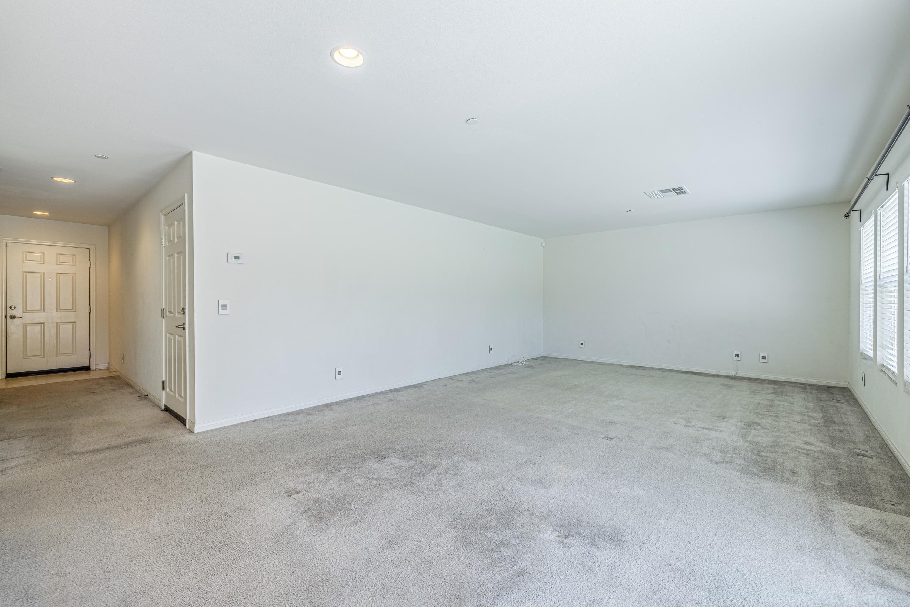 2732 Hemlock Road Palmdale, CA 93551 - Photo 14 of 42 an empty room with a natural light