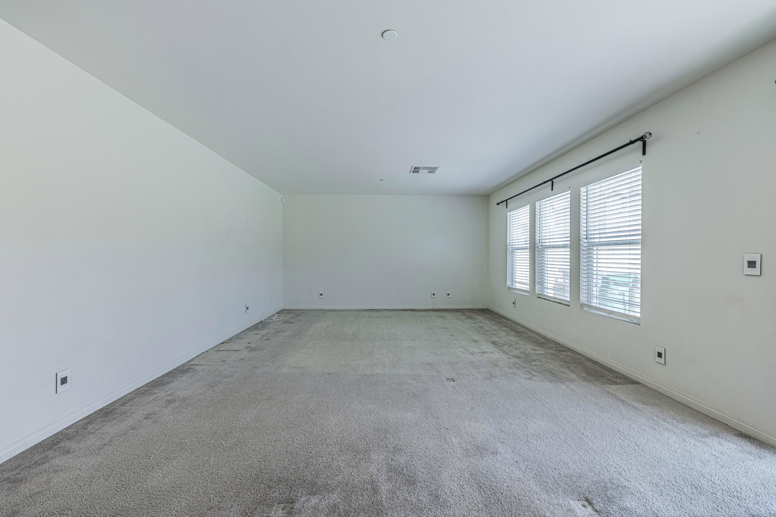 2732 Hemlock Road Palmdale, CA 93551 - Photo 15 of 42 an empty room with a window