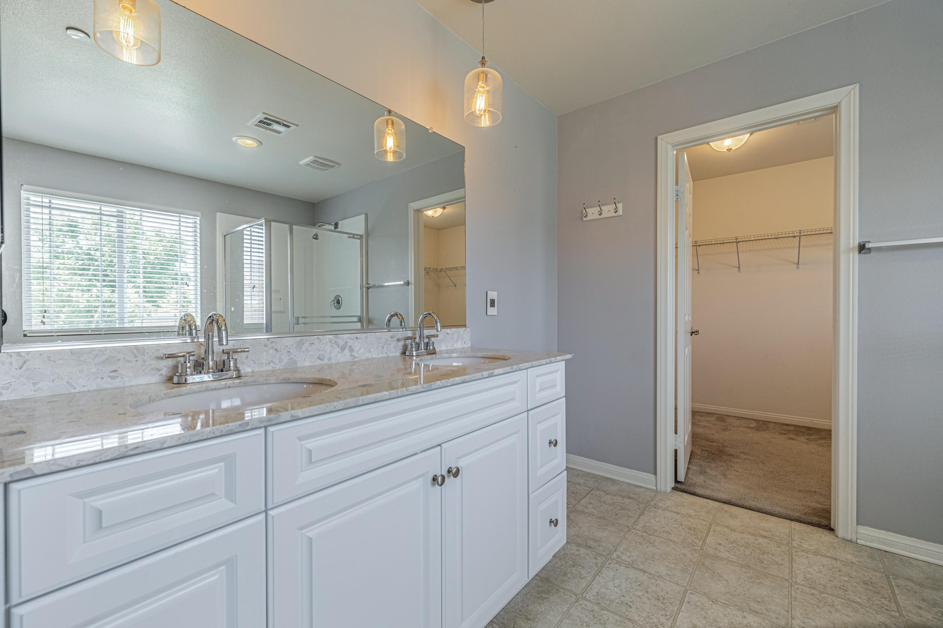 2732 Hemlock Road Palmdale, CA 93551 - Photo 18 of 42 a bathroom with a granite countertop sink mirror and