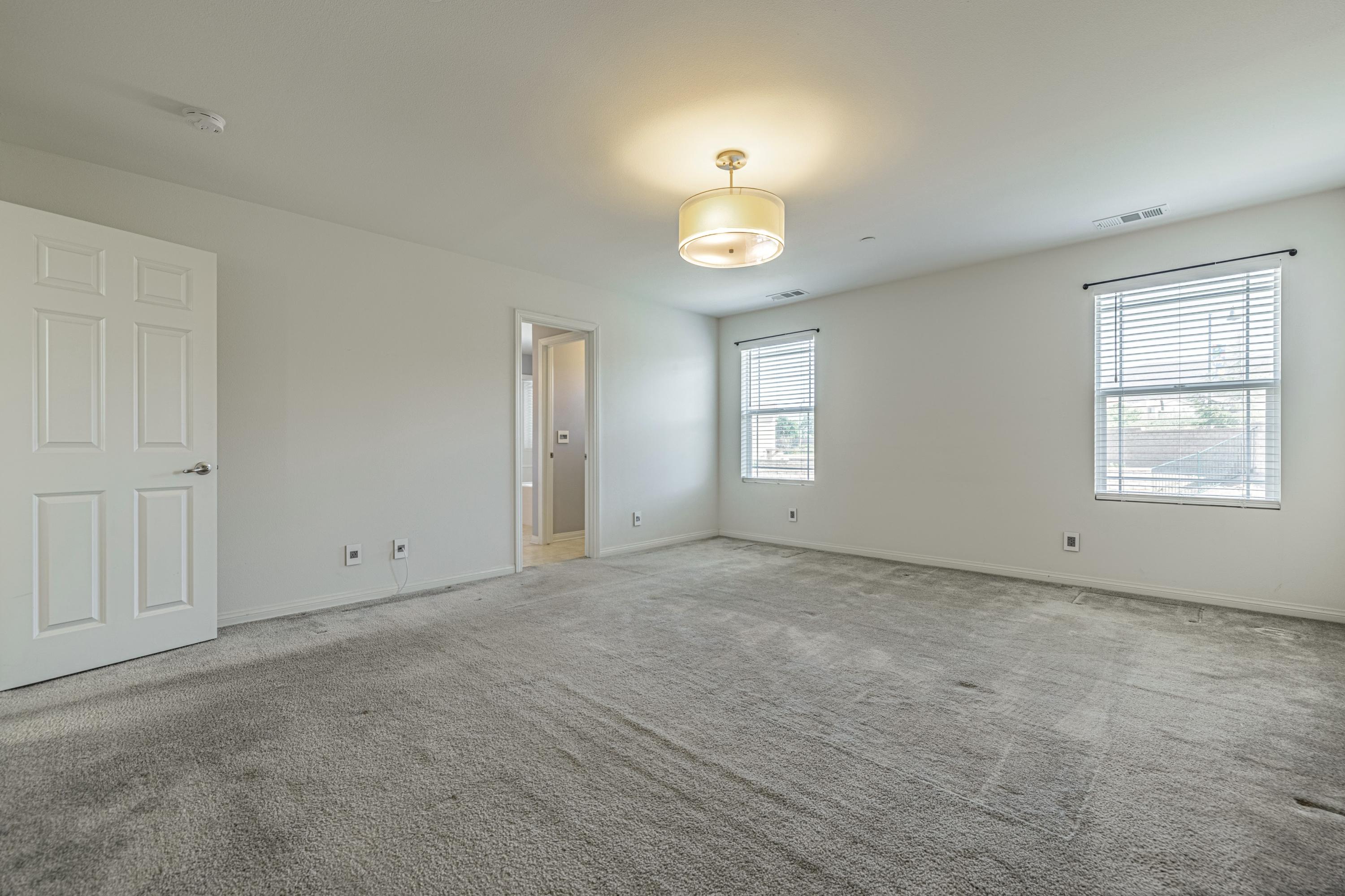 2732 Hemlock Road Palmdale, CA 93551 - Photo 22 of 42 a view of an empty room with a window