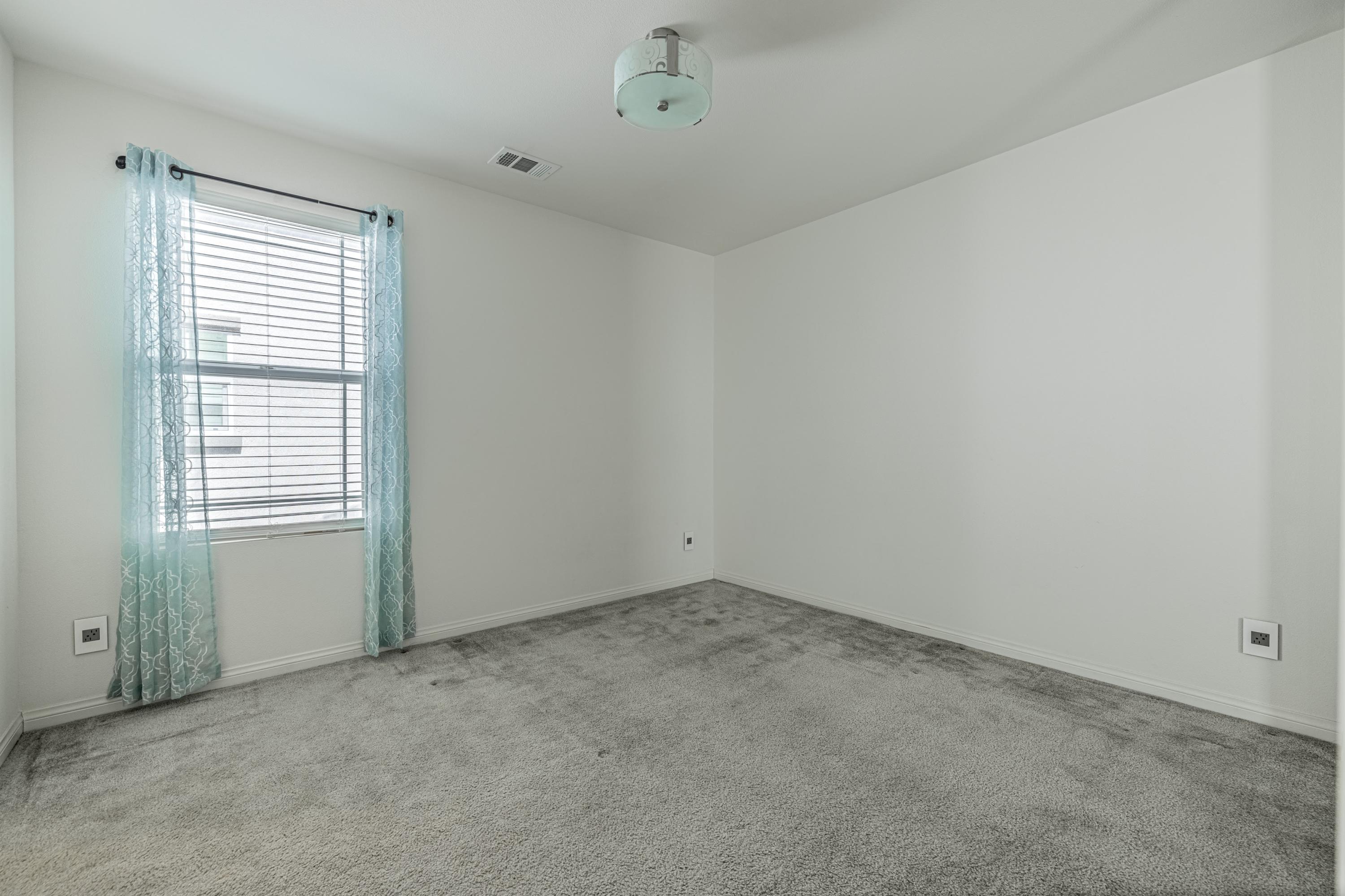 2732 Hemlock Road Palmdale, CA 93551 - Photo 23 of 42 an empty room with a window