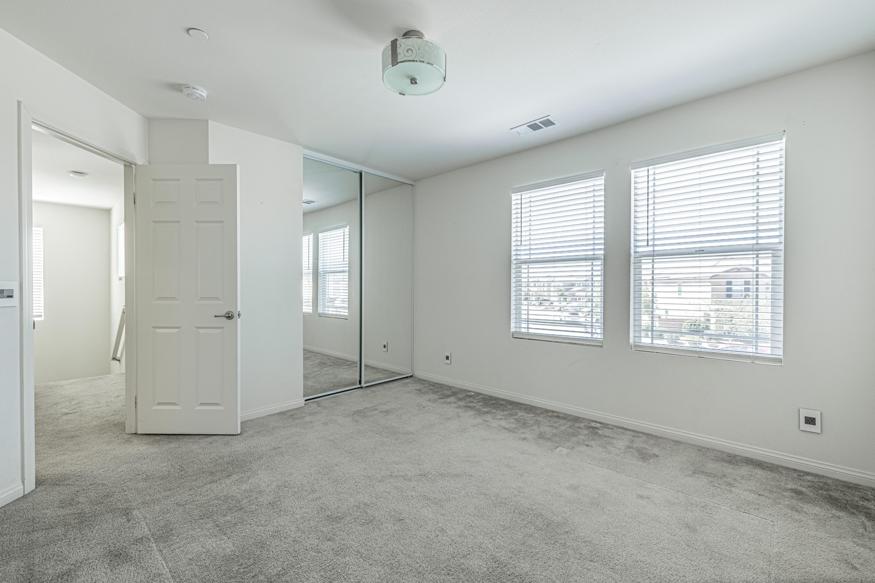 2732 Hemlock Road Palmdale, CA 93551 - Photo 26 of 42 a view of an empty room with a window