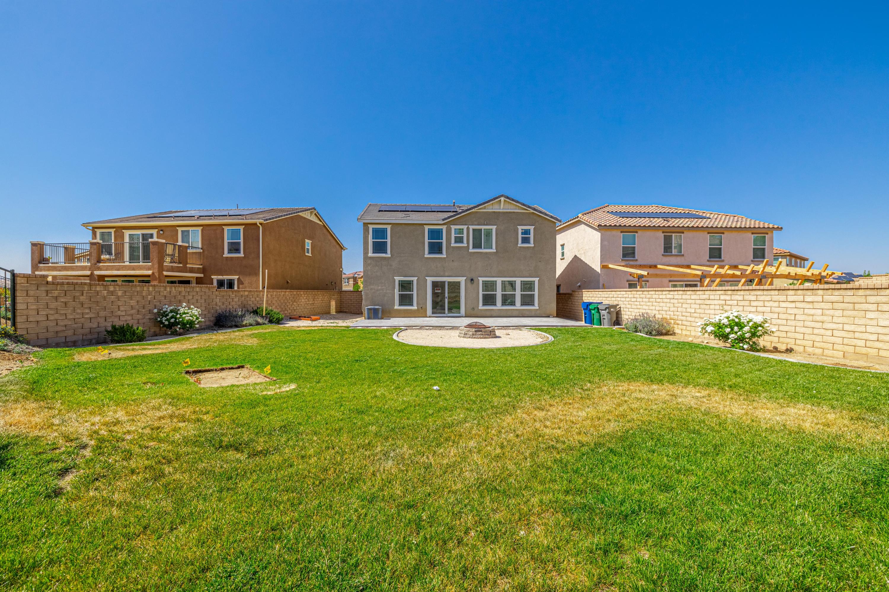 2732 Hemlock Road Palmdale, CA 93551 - Photo 32 of 42 a front view of a house with garden