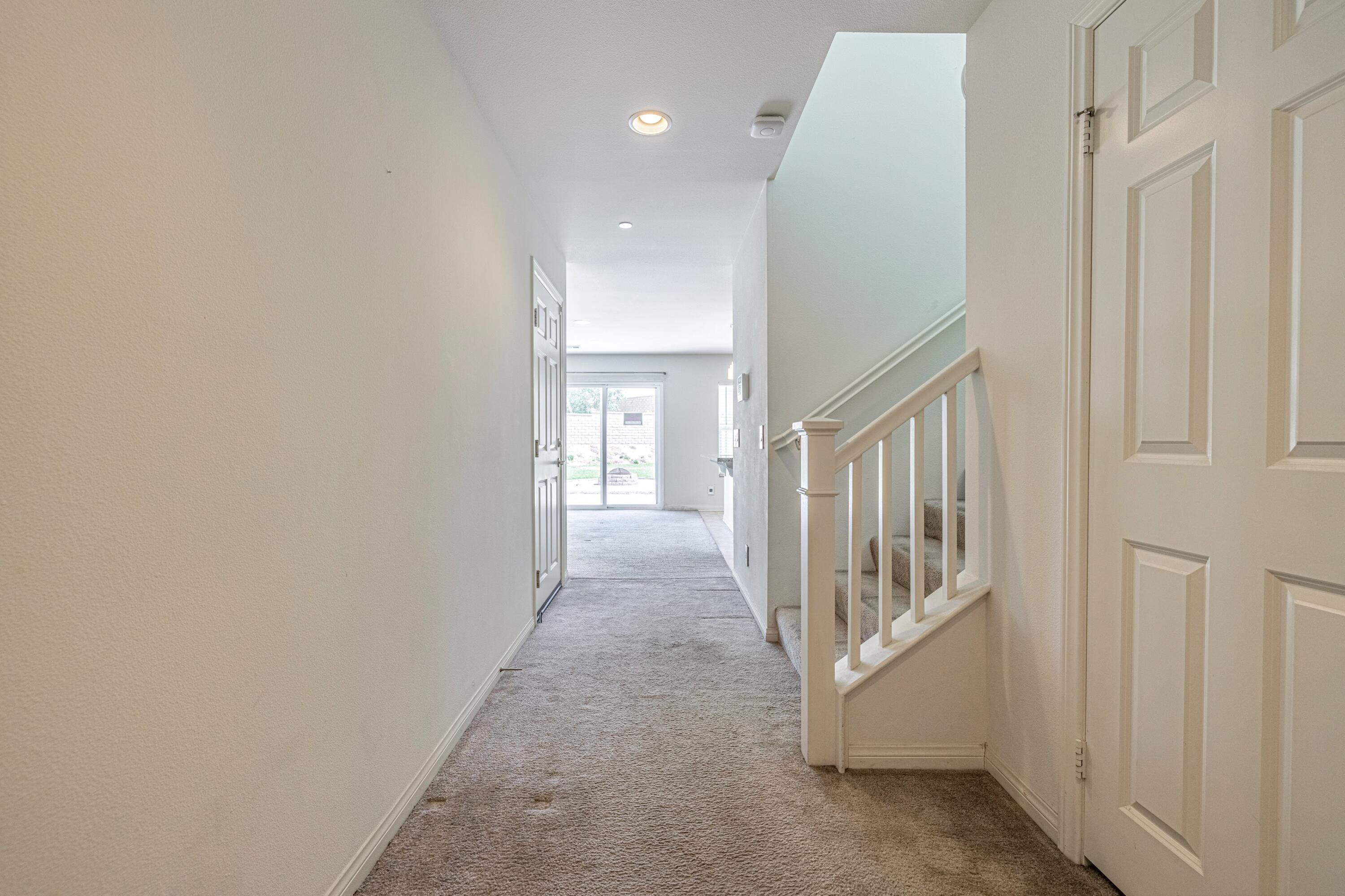 2732 Hemlock Road Palmdale, CA 93551 - Photo 5 of 42 a view of a hallway with windows