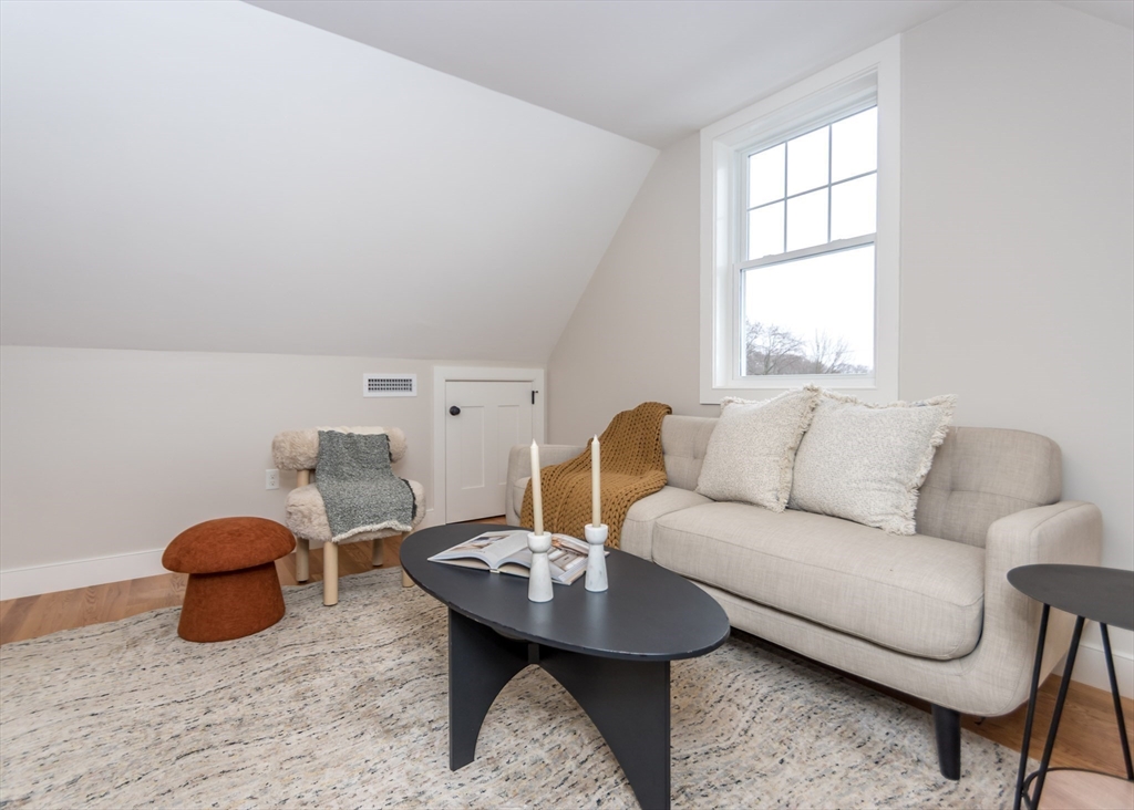 89 Hardy Pond Road Waltham, MA 02451 - Photo 26 of 39 a living room with furniture and a table