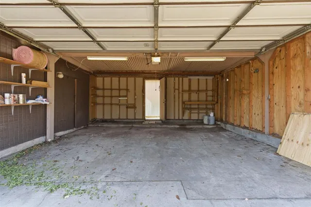 a view of an empty room with windows