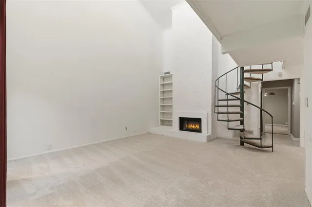 a view of a livingroom with a fireplace